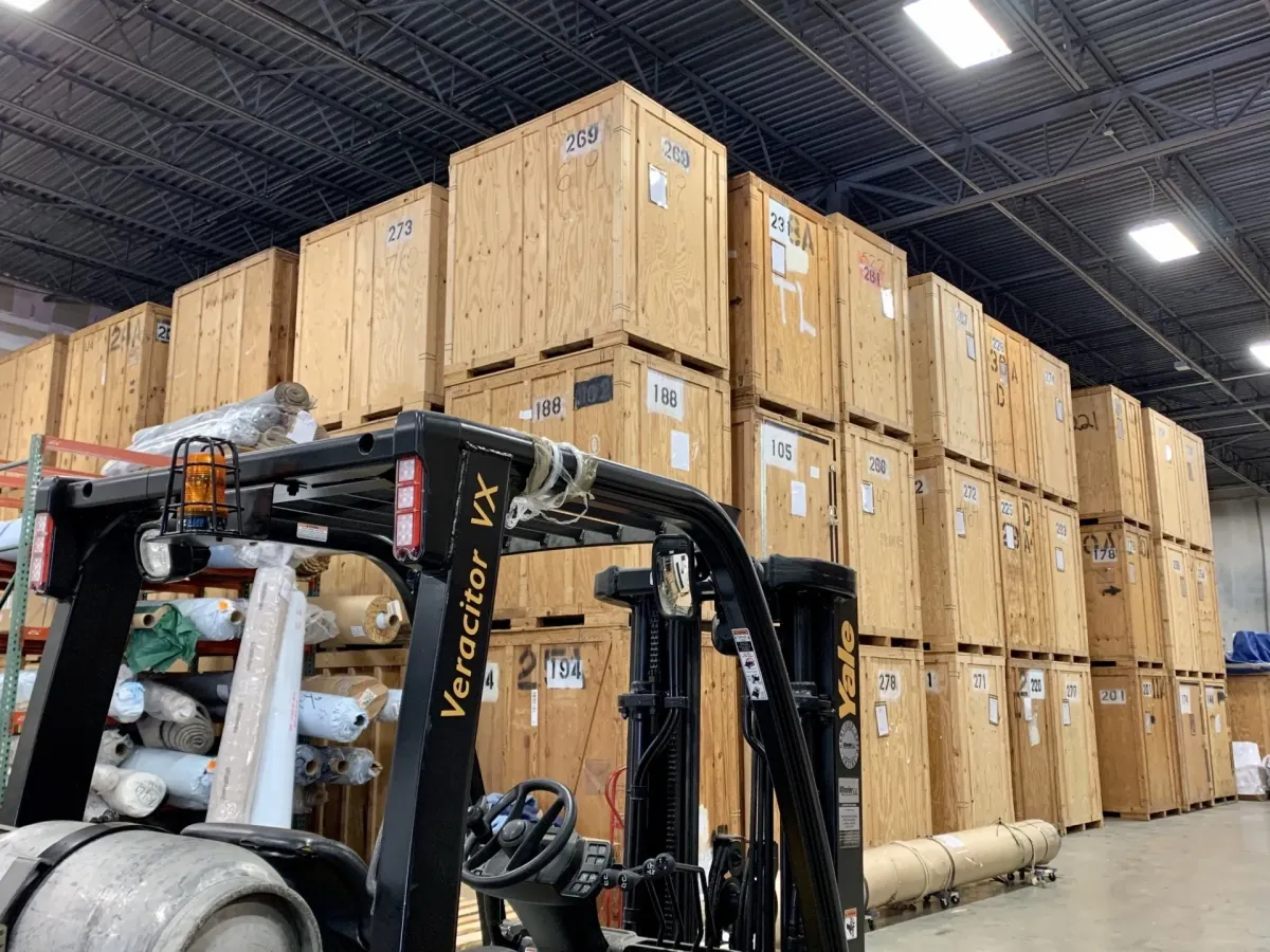Sealed wooden storage vaults inside the Make A Move Charlotte warehouse